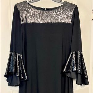 Never work black sequin dress with bell sleeves.